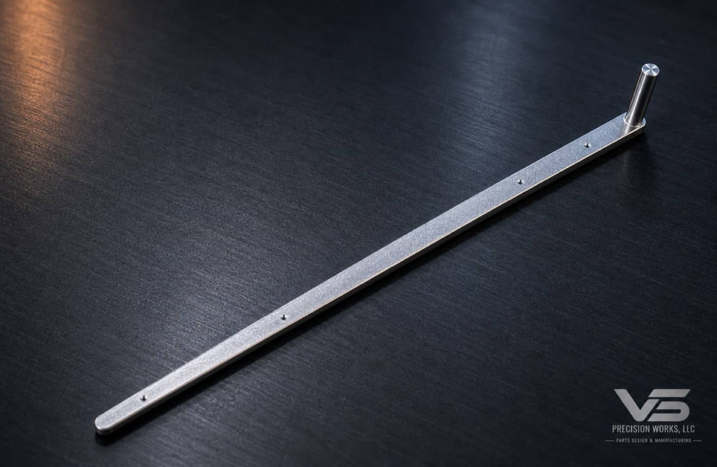 Long milled mandrel component with small holes and raised pin