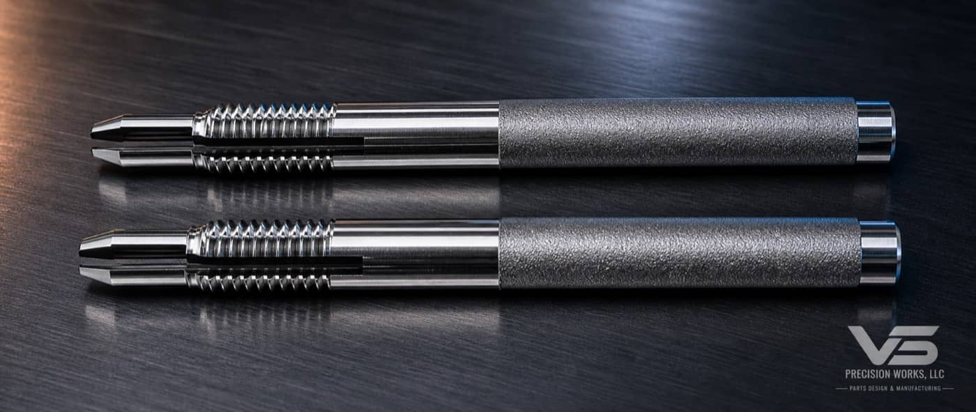 Matched pair of Swiss-turned threaded and slotted stainless shafts
